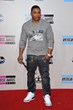 Nelly Cruises Down The AMAs Red Carpet in Robin's Jean