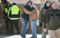6 RESCUED: A woman hugs Chris Montes after hearing that Montes was one of the rescuers that found a family in a remote mountain range northeast of Reno, in Lovelock, Nevada, Dec. 10. Photo: Reuters/James Glover - See more at: http://kmit.com/news/030030-6