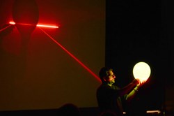 Red plus green makes ... yellow, when it comes to lasers, demonstrates Laser Roadshow founder Chris Volpe during an middle school presentation earlier this year.