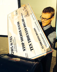 Bows-N-Ties' CEO Hendrik Pohl puts the $10,000 Donation Check in the Mail