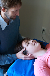 Dr. Chris Larson Treating Patient