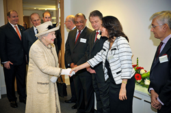 Muna Issa greets HM The Queen while HRH The Duke of Edinburgh and HRH The Earl Of Wessex look on
