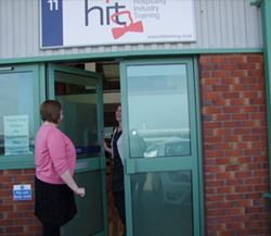 A customer is welcomed into Waterhouse Business Centre