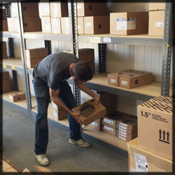 A Docucopies team member stocks binding supplies at the new facility.