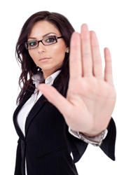 Image credit: <a href='http://www.123rf.com/photo_9971973_serious-business-woman-making-stop-sign-over-white.html'>feedough / 123RF Stock Photo</a>