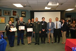 Winners and Judges Left to right: Madelyne Killelea, third place, Christian Mendoza, second place and Brianna Seratto, first place, Major General Charles Rodriguez, Corey Ryan, Colonel Norris Miller Overly, Dr. Juan D. Villarreal, Casandra Garcia, back