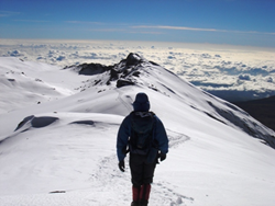 Climber near Uhuru Peak, Mount Kilimanjaro's summit.