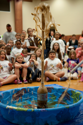 girls watching geyser explode at STEM day