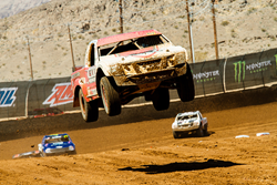 TORC trucks fly as high as 150 feet in the air as they race over bumps and moguls on the dirt track.