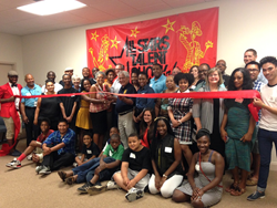 All Stars Project of Bridgeport Director Pam Lewis and Launch Chair Charlie Adams lead the ceremonial ribbon-cutting, supported by local nonprofit leaders, philanthropists, youth and community members.