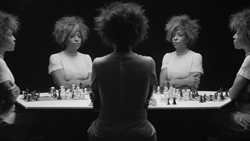 Still from the video Chess, 2013, by Lorna Simpson