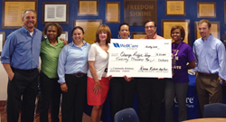 WellCare of Georgia was proud to present a check for $20,000 to the Orange Duffle Bag Initiative at Frank McClarin High School’s community resource fair and family festival in College Park, Ga.