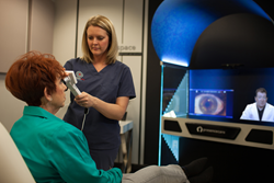 A nurse demonstrates how the Optimized Care Network system works by allowing a doctor to consult on care from a remote office. For more information: bit.ly/ZaSypy