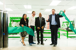 Theresa Mendoza, Office of Economic Development, Mike Pickford, RavenBrick, Denver Mayor Michael B. Hancock, and Alex Burney, RavenBrick cut the ribbon for the RavenWindow Automated line launch