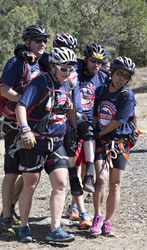 A team carries an athlete with disabilities at the Adventure Team Challenge.