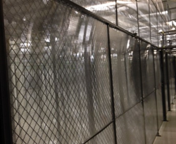 The Cool Shield aisle containment solution converts cage walls into a solid vertical partition