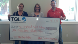 TQL Nashville employees present donation as part of Moves that Matter program.