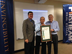 First Team Founder Cameron Merage (center) and longtime Executive Vice President Bill Plattos (right) are presented with a Resolution from the California State Legislature by Assemblyman Don Wagner.