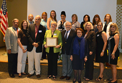 Mary Ann Uzzi receives Dr Celia Weisman Award; family and coalition members attended ceremony.