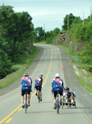 CanAm Veterans Challenge athletes ride bicycles along the highway on route to Washington, D.C.