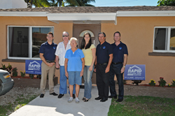 L to R: Jason Coben, Manager, Rapid Response Team; Roy and Barbara Gladde; Sandra Veszi-Einhorn, Executive Director, Rebuilding Together Broward; Charles Dixon, Director of Roofing Operations, RRT Roofing; Kevin Walton, COO, Rapid Response Team.