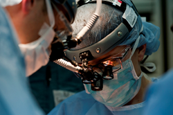 Surgeon operating.