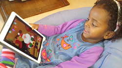 Little girl chatting to Santa on her iPad