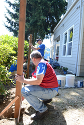 Volunteers for the ATGStores.com All That's Good Deeds charity program help restore a youth outreach center in Washington state.