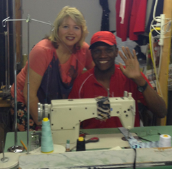 Pierre Garnaud, with his boss, Karina Bramer, at his job as a tailor.