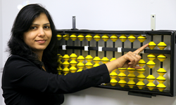 Center Director Shilpi Agrawal and display abacus at the New ALOHA Mind Math learning center in Corona California