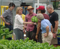 Rebecca Nelson sharing aquaponically-grown lettuce at the Aquaponics Master Class