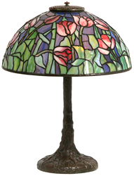 A strong candidate for top lot of the auction promises to be a Tiffany Studios Tulip table lamp with domical shade having a background with wonderful blue translucent hammered textured glass with hints of purple, red and opaque striated tulip flowers, sur