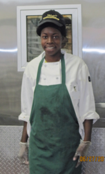 Photo of Latoya Bristor, who has a disability, at her job at Wright's Gourmet Deli in Tampa, FL