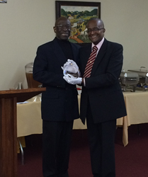 Dr. Orrington receiving an Outstanding Services Award from the Orrington Institute