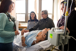 Students gaining first-hand experience in an SJC nursing skills lab.