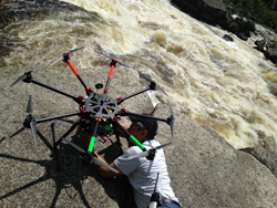 Setting up the drone for a shot of whitewater rafters in Maine