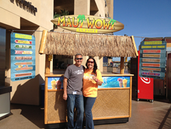 Ron and Barb Putman stand in front of their Maui Wowi cart, one many units the couple operates as franchisees and Directors of Regional Support.