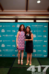Logan Aguirre, vice president of 417 Magazine, presents Bethany Bell with her award at the 10th Annual 20 Under 30 Ceremony.