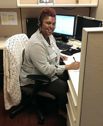 Photo of Kathy Batson, executive assistant to the vice president of Core Logic, works at her computer.