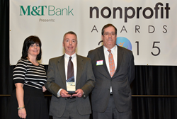 Kevin Morgan, president and CEO of ProLiteracy (center), named Executive of the Year at the 2015 Nonprofit Awards. He's pictured with Alissa Viti, charitable and community relations manager at M&T, and Tom Fiscoe, partner and CPA at Dannible & McKee, LLP.