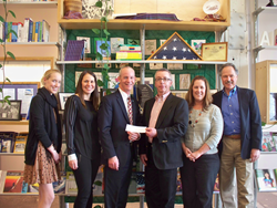 Kevin Hanna of AT&T presents a check to ProLiteracy staff. The contribution will support a joint financial literacy project with AT&T, ProLiteracy, and WCNY.