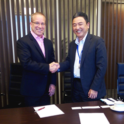 Image of Meiji President, Hiroki Sugiwaki and DTx VP, Brad Jens Signing Partnership Agreement