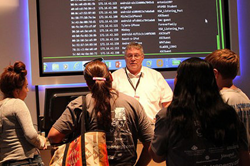 EMCC Instructional Computing faculty, Larry Heinz, explains cybersecurity to high school students.