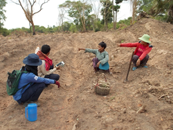 A HALO survey officer using a tablet to collect data about landmines from farmers in Otdar Meanchey Province, Cambodia