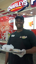 Photo of Kevin Durden at work as a full time sampler at Charley's Grilled Subs.