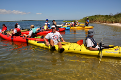 Team members at the Long Island shore in 2014.