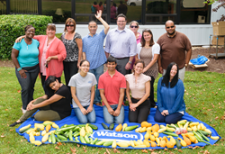 Watson Employees with the Food from their Gardens