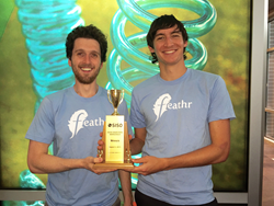 (image of Feathr co-founders holding trophy)