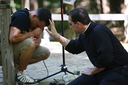 Justin Fatica prays before a show