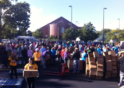 Volunteers pack meals at De-Feet Hunger in Kansas City